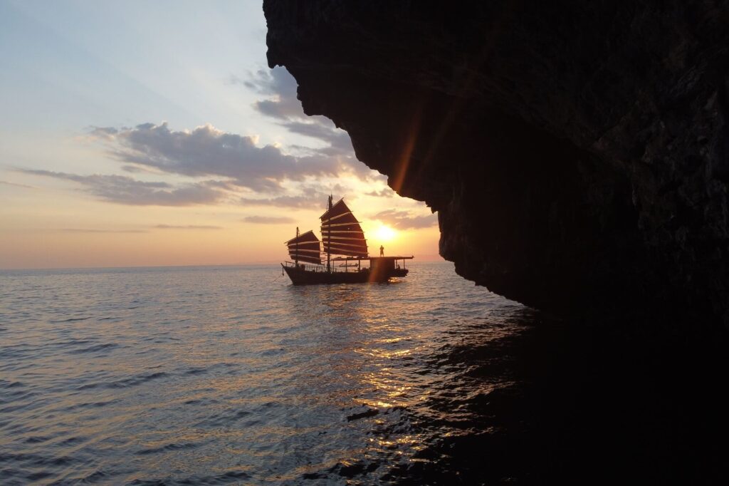 krabi sunset cruise ship at sunset, framed by krabi's limestone islands