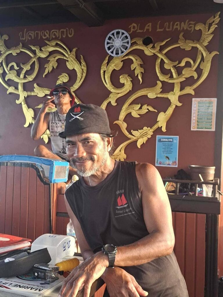 Pi Pae, Krabi Sunset Cruises tour guide, aboard the traditional wooden boat